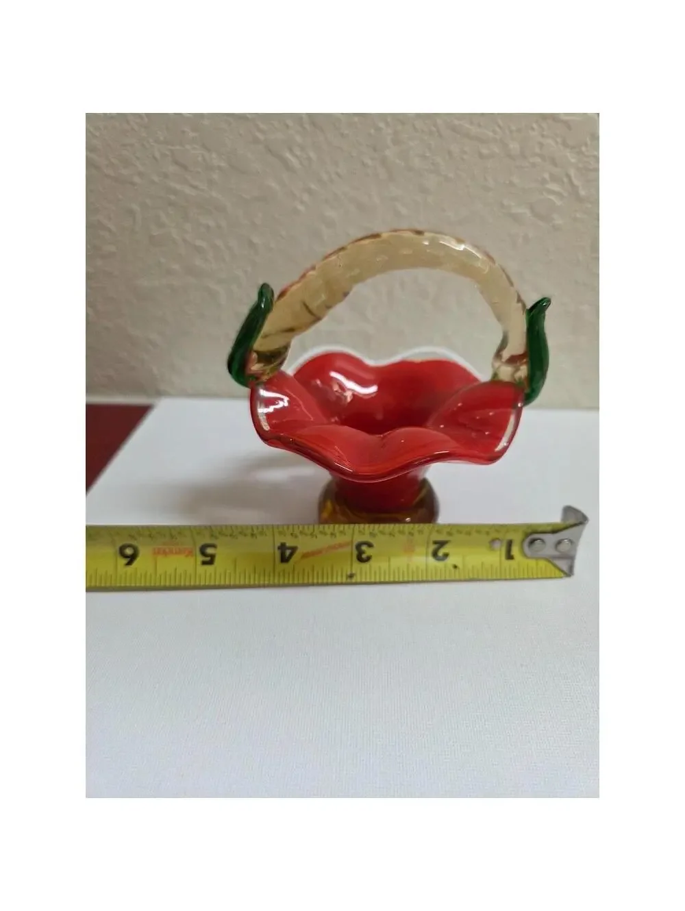 Vintage hand blown art Glass basket. Red, tan and green in color.